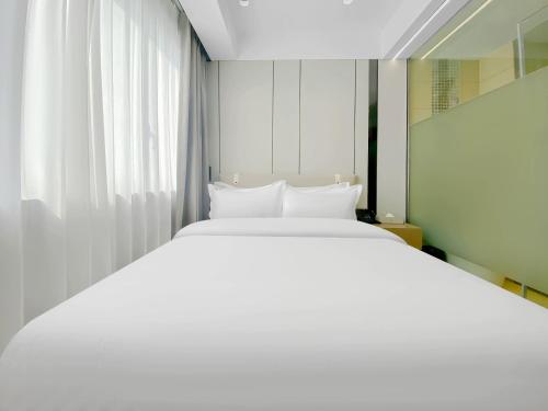 Katil atau katil-katil dalam bilik di Shanghai Platinum Hotel
