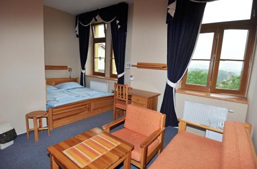 Postel nebo postele na pokoji v ubytování Hotel U Radnice