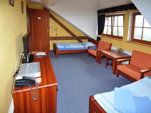 Postel nebo postele na pokoji v ubytování Hotel U Radnice