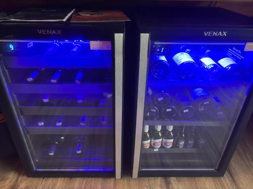two bottles of wine are in a refrigerator at Paraíso da Harmonia in Teutônia