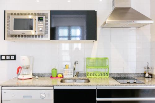Η κουζίνα ή μικρή κουζίνα στο Apartamentos Tito San Agustin