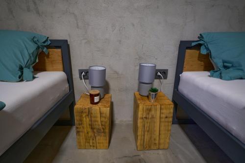 two twin beds with nightstands with twounks at Shi-lu 