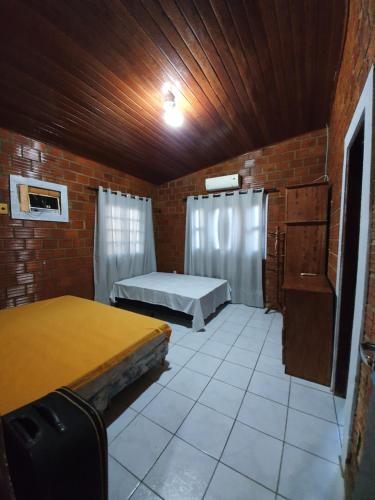 Postel nebo postele na pokoji v ubytování Casa Gravatá 20 hóspedes! Melhor localização!