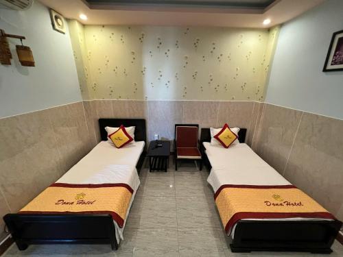 Postel nebo postele na pokoji v ubytování DONA hotel