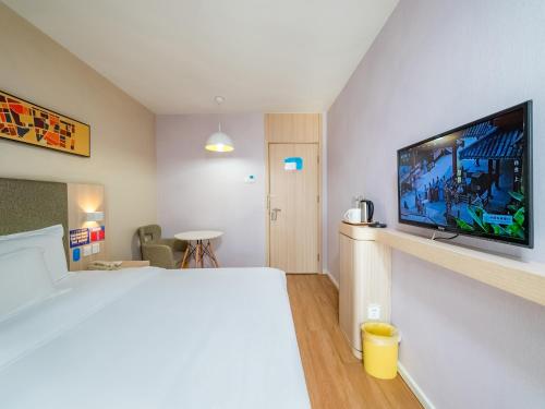 Postel nebo postele na pokoji v ubytování Hanting Hotel Beijing Guang'anmen Xuanwu Hospital