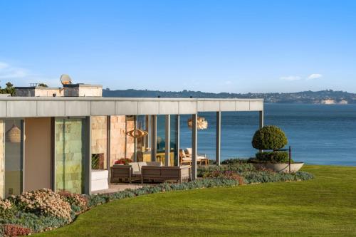 a house with a view of the water at Waiheke Island Coastal Retreat in Waiheke Island