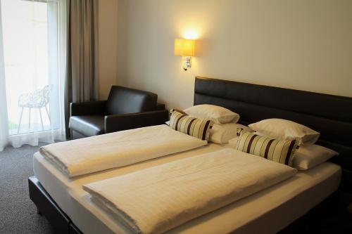 Postel nebo postele na pokoji v ubytování Tschuggmall Appartements