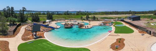 an overhead view of a large swimming pool at BIG4 Saltwater Yamba Holiday Park in Yamba