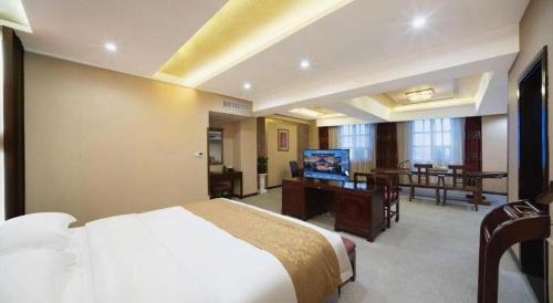 Postel nebo postele na pokoji v ubytování Dengfeng Chanwu Hotel