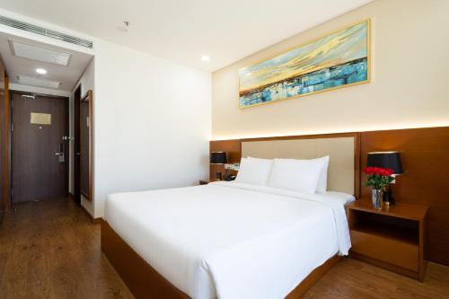 Ένα ή περισσότερα κρεβάτια σε δωμάτιο στο Victory Hotel Vung Tau - New Wing