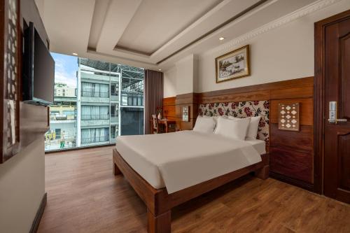 Katil atau katil-katil dalam bilik di A9 Beach Hotel Da Nang