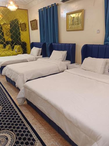 Postel nebo postele na pokoji v ubytování Al Naaman Bin Al Munther Guest House