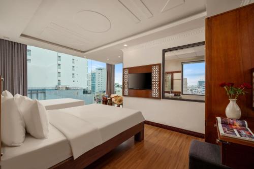 Katil atau katil-katil dalam bilik di A9 Beach Hotel Da Nang