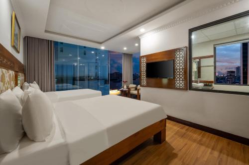 Katil atau katil-katil dalam bilik di A9 Beach Hotel Da Nang