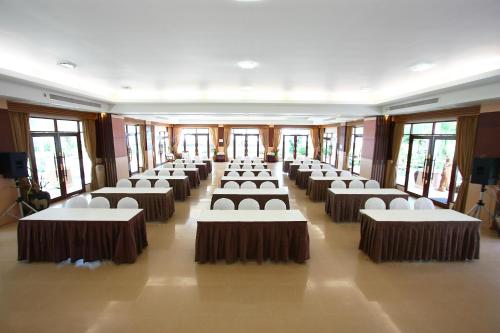 a large room with rows of tables and chairs at Pakmeng Resort in Pak Meng