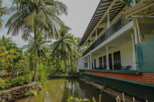a house with a river in front of it at Villa Gaetano Unawatuna in Unawatuna