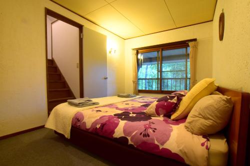 Postel nebo postele na pokoji v ubytování Chalet Myoko