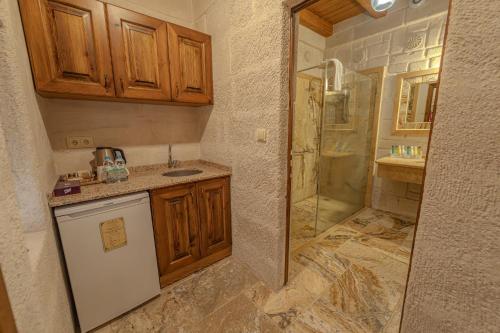 a bathroom with a shower and a sink at Zara Cave Hotel in Goreme