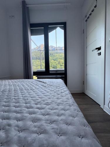 Postel nebo postele na pokoji v ubytování Peak View Tiny House