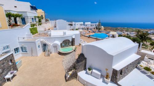 an aerial view of a villa with a swimming pool at Dream Island Hotel in Fira