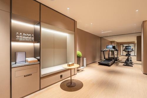 a salon with a barber shop with a hair dryer at JI Hotel Beijing Changping Future Science City in Beijing