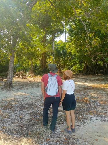 a man and a woman walking in a park at Nio Homestay and Tour in Licin