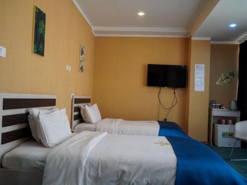 Кровать или кровати в номере Castella Hotel Ulaanbaatar