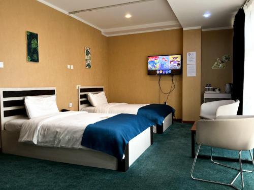 Кровать или кровати в номере Castella Hotel Ulaanbaatar