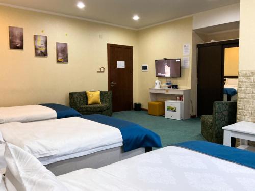 Кровать или кровати в номере Castella Hotel Ulaanbaatar