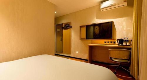 Μια τηλεόραση ή/και κέντρο ψυχαγωγίας στο IU Hotel Tianjin Xiqing Zhong Bei Zhen Branch