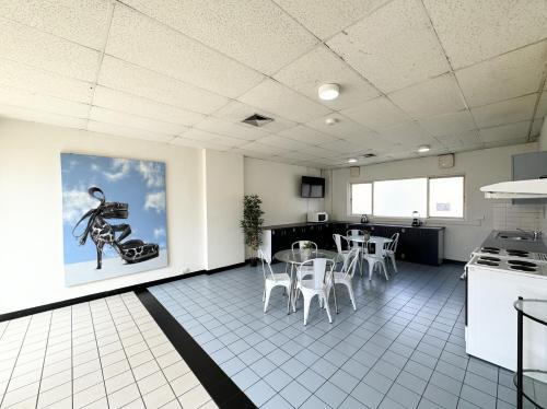 a kitchen and dining room with a table and chairs at 360K - Central Comfy Great Value - City in Melbourne