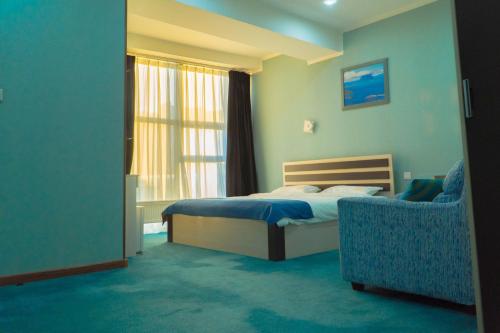 Кровать или кровати в номере Castella Hotel Ulaanbaatar
