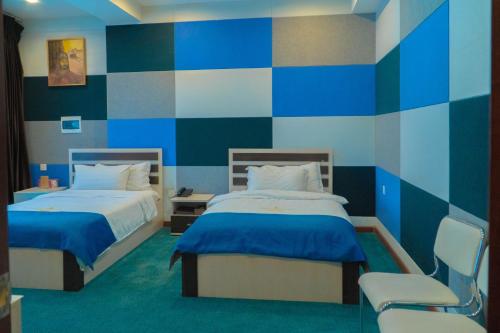 Кровать или кровати в номере Castella Hotel Ulaanbaatar