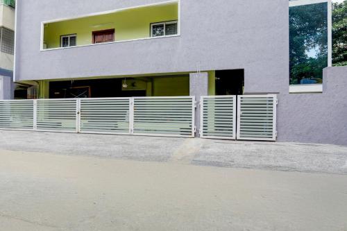 a building with a fence in front of it at Collection O Tirupati Railway Junction Formerly Y Stay Home Stay in Tirupati