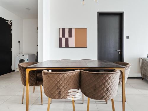 a dining room with a table and chairs at Opus by Soulasia in Kuala Lumpur