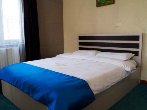 Кровать или кровати в номере Castella Hotel Ulaanbaatar