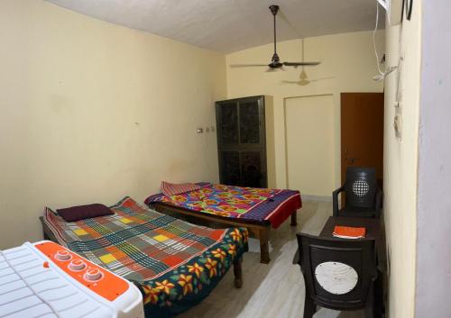 Ένα ή περισσότερα κρεβάτια σε δωμάτιο στο Jaykishan sadan