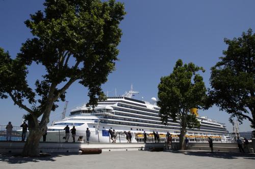 a cruise ship is docked in a harbor at Apartments & rooms Artemus Belveder in Koper