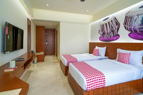 Cama o camas de una habitación en Open Hotel by Olive - Tulips Inn and Suites