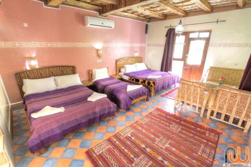 Ένα ή περισσότερα κρεβάτια σε δωμάτιο στο Kasbah Restaurant Amazir
