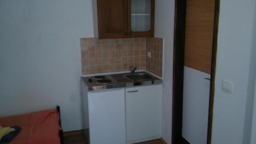 a small kitchen with a sink and a counter at Holiday Home Angela in Medulin
