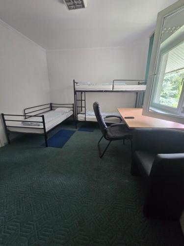 Una cama o camas en una habitación de Hom Wawer