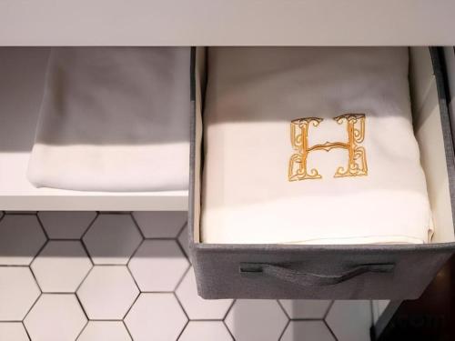a box with two gold rings sitting on a shelf at Harbour Bay Hotel in Hong Kong