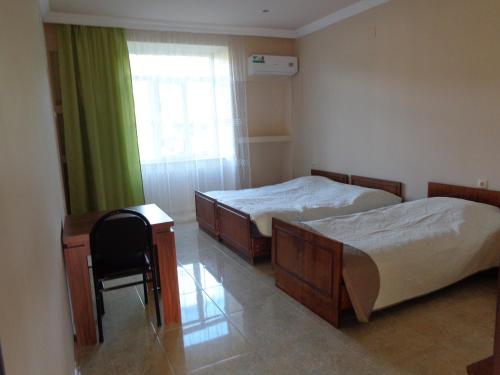 Postel nebo postele na pokoji v ubytování Guest House Vitali