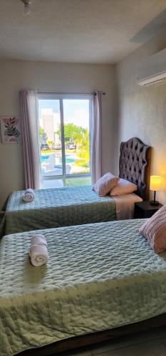 Ένα ή περισσότερα κρεβάτια σε δωμάτιο στο Casa Oasis Veracruzano