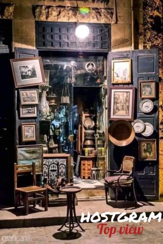 a room filled with lots of pictures on a wall at Hostgram Top View in Cairo