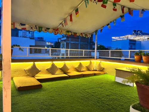 a group of couches on the roof of a building at Holiday Hostel Kathmandu in Kathmandu