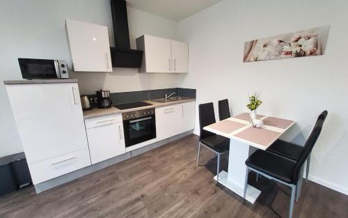Kuchyň nebo kuchyňský kout v ubytování Gästehaus Veldhausen