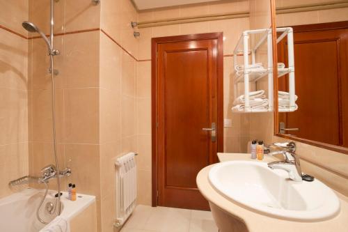 a bathroom with a sink and a toilet and a shower at Cabot Villa Can Borras in Port de Pollensa