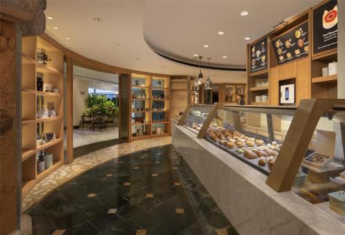a bakery with a display case in a store at Grand Hyatt Erawan Bangkok in Bangkok